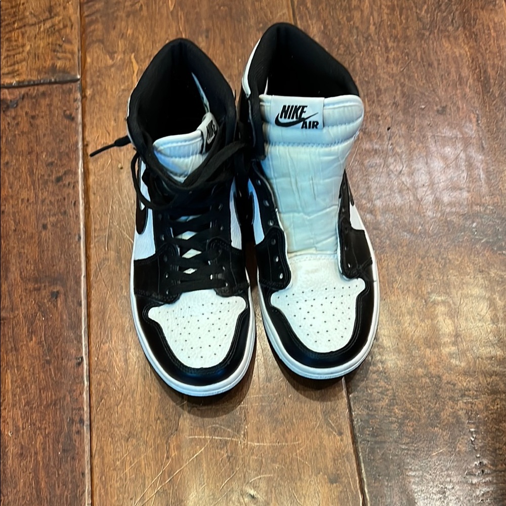 Nike panda . We are not sure if real or not Black and White Women's Sneakers